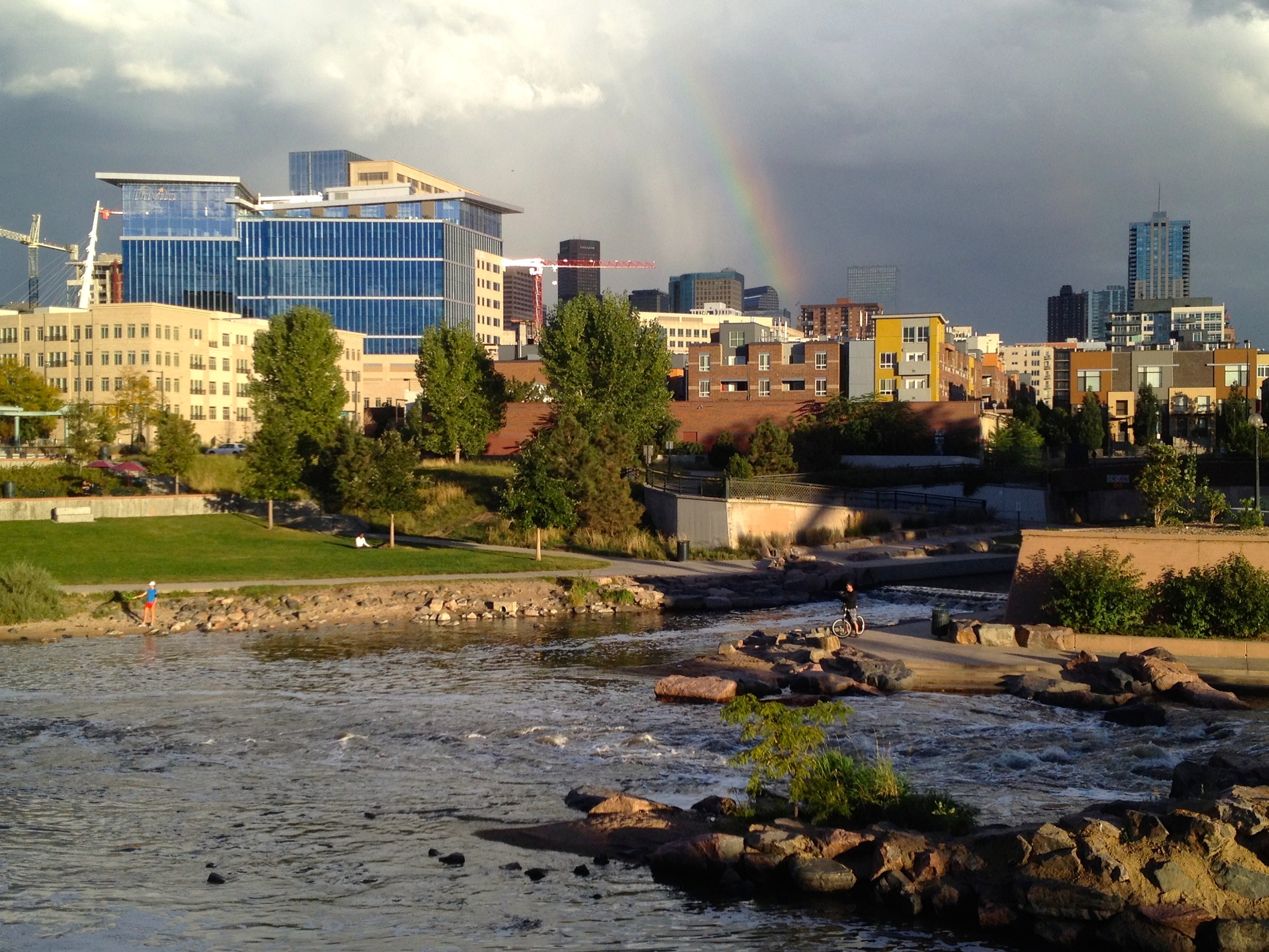 The Denver skyline and a rainbow over Confluence Park