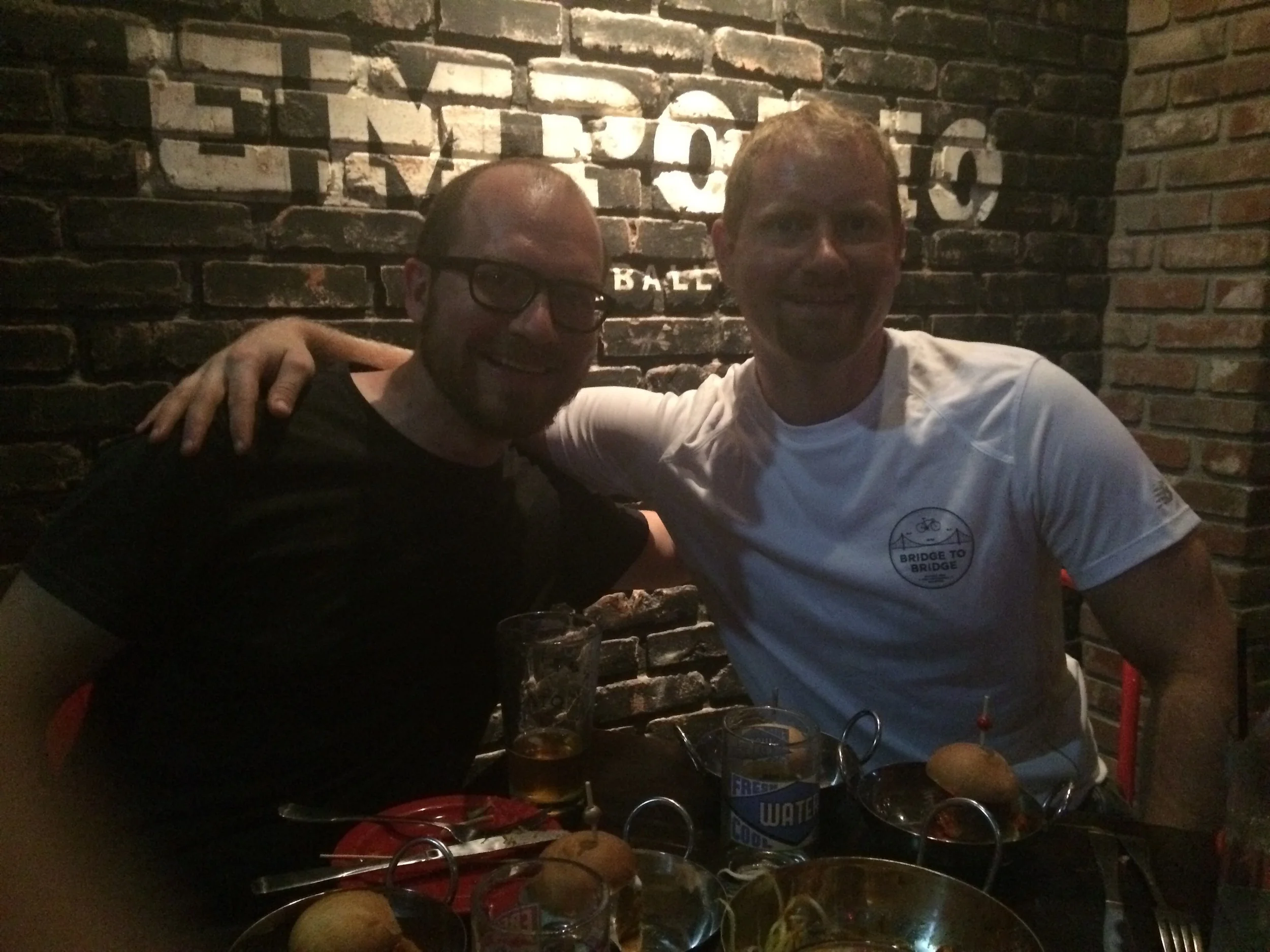 Two brothers eating meatballs
