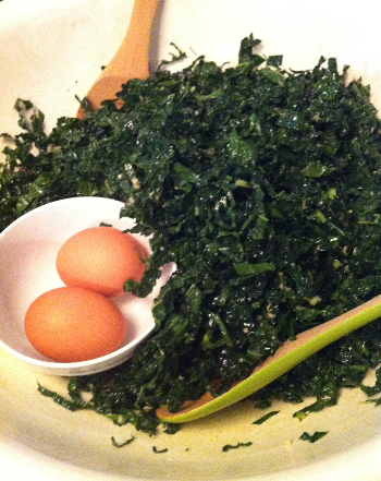 The salad is dressed, all it needs is the grated eggs just before serving