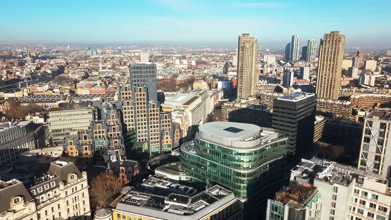 Sunny aerial drone photograph of One London Wall offices in the Barbican, demonstrating architectural establishing shots for corporate business.