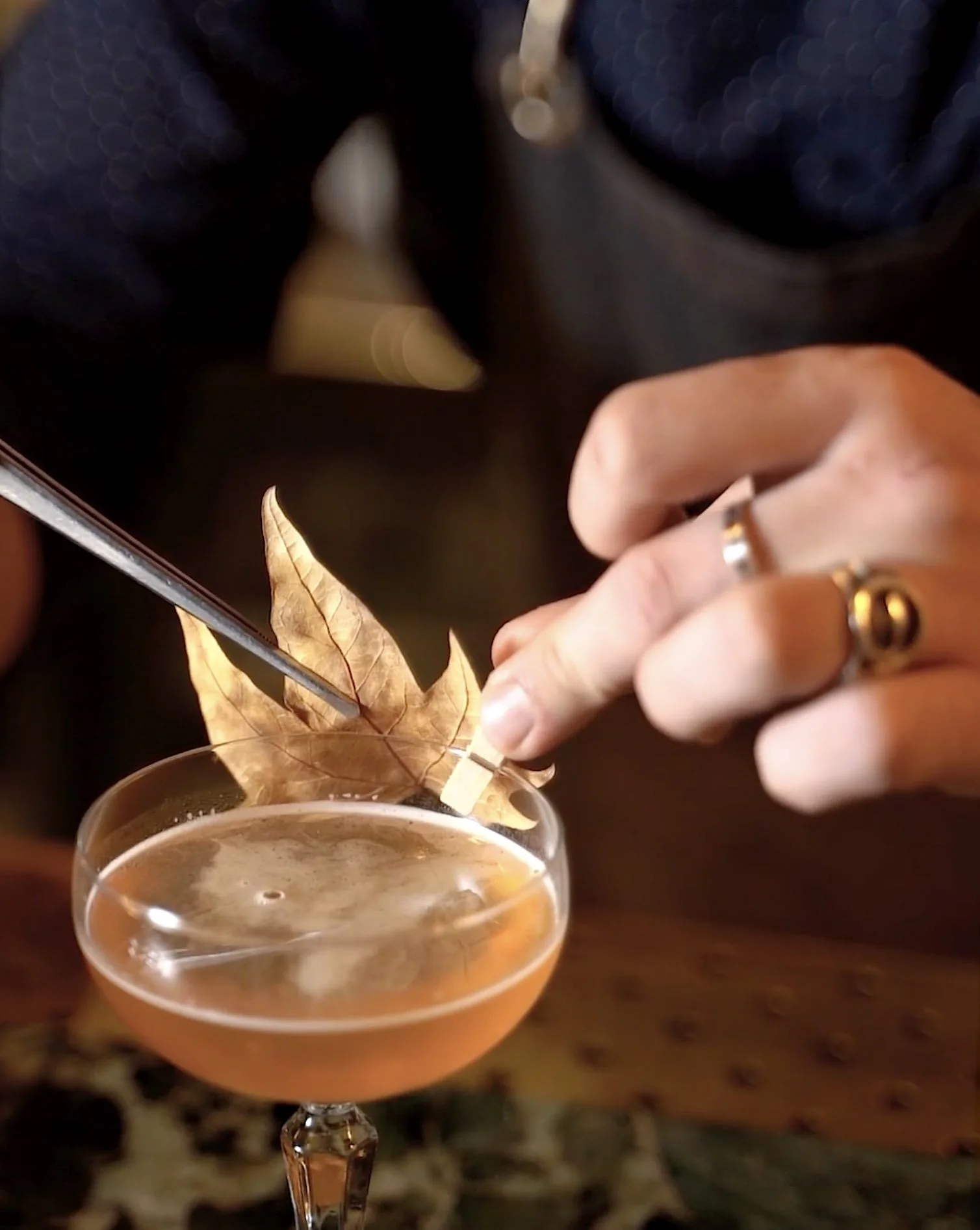 High-speed cinematic action shot of a luxury cocktail at Coal Shed London, illustrating professional social media content and high-end visual storytelling for the hospitality sector.