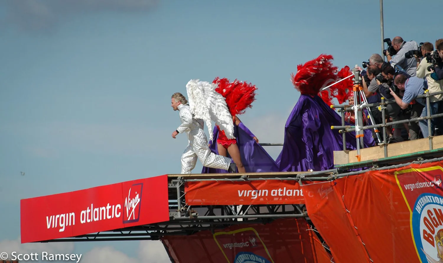 Richard Branson dressed in a silver suit and wearing wings runs off the pier whilst taking part in the Bognor Birdman contest in West Sussex.
