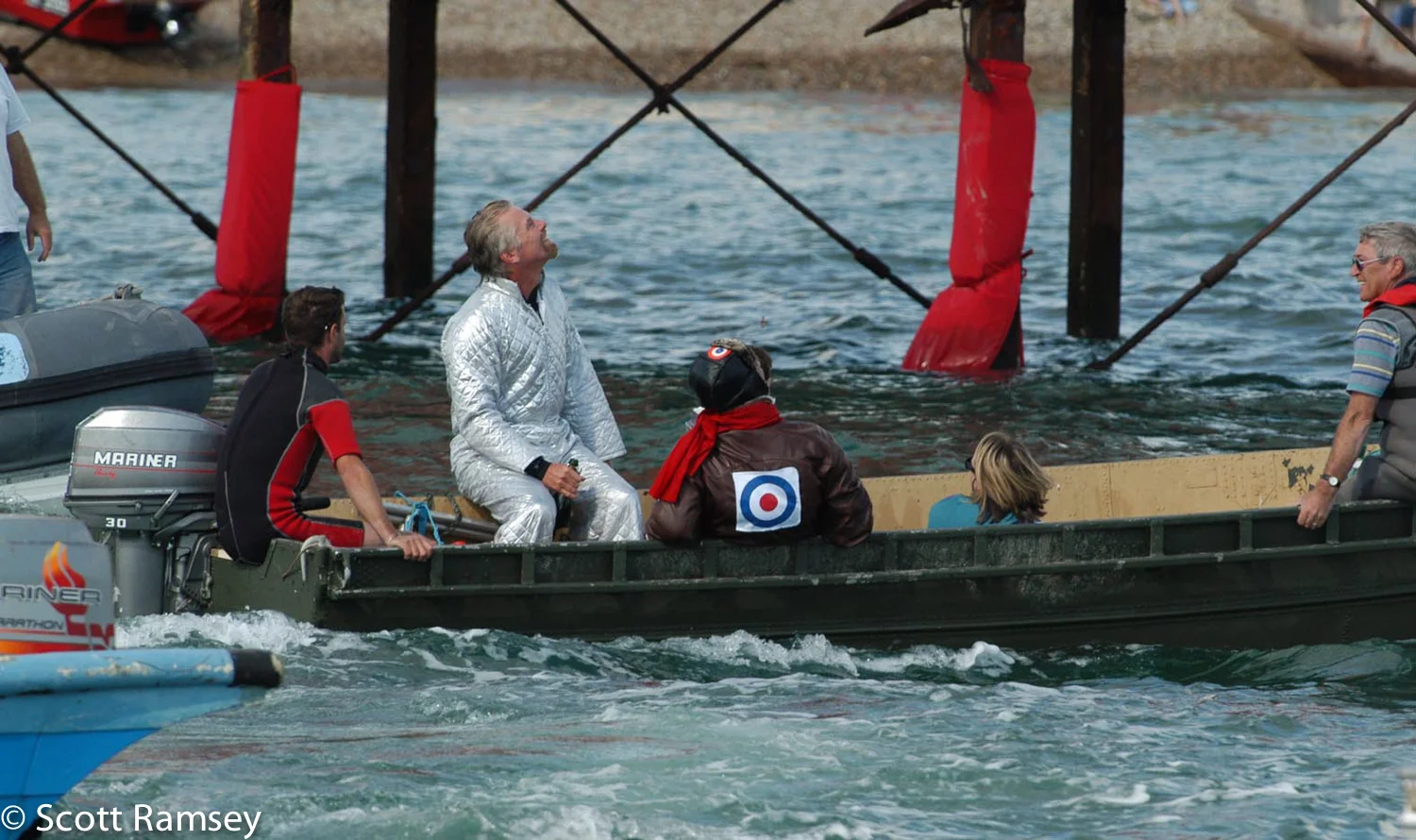 Safe in a rescue boat, Richard Branson heads back to the shore after jumping off a pier during the Bognor Birdman contest in West Sussex.
