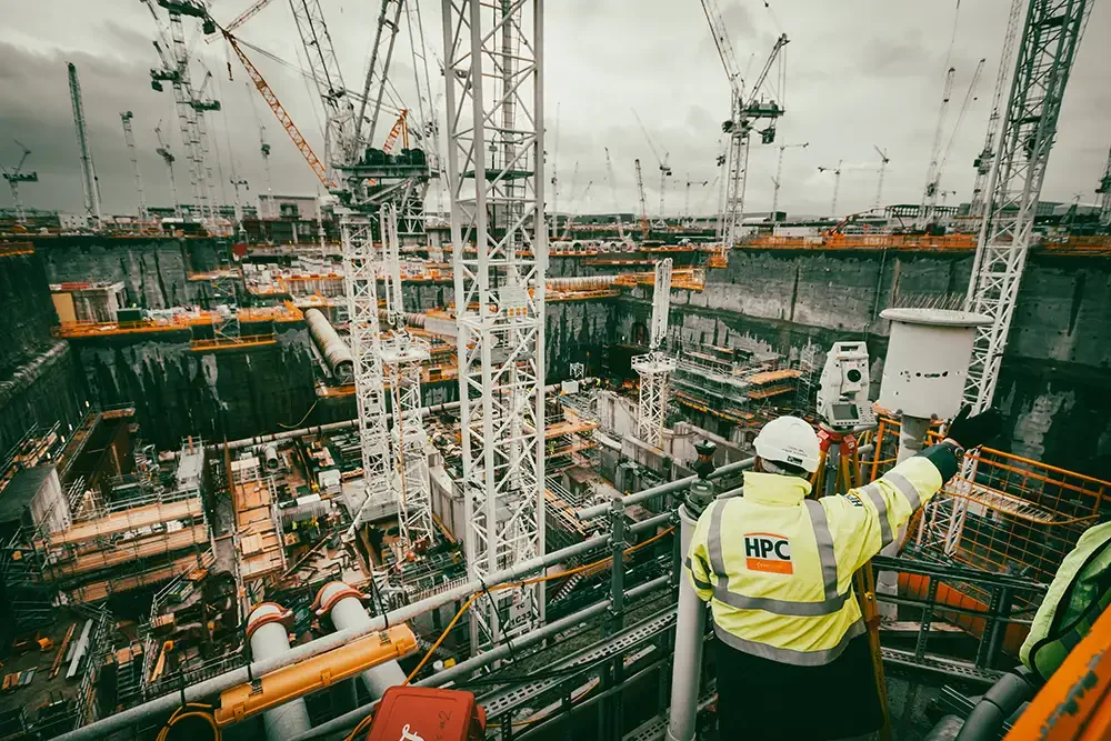 National infrastructure and industrial photography by the Scott Ramsey Agency, featuring a civil engineer on-site at Hinkley Point C Nuclear Power Station, England.