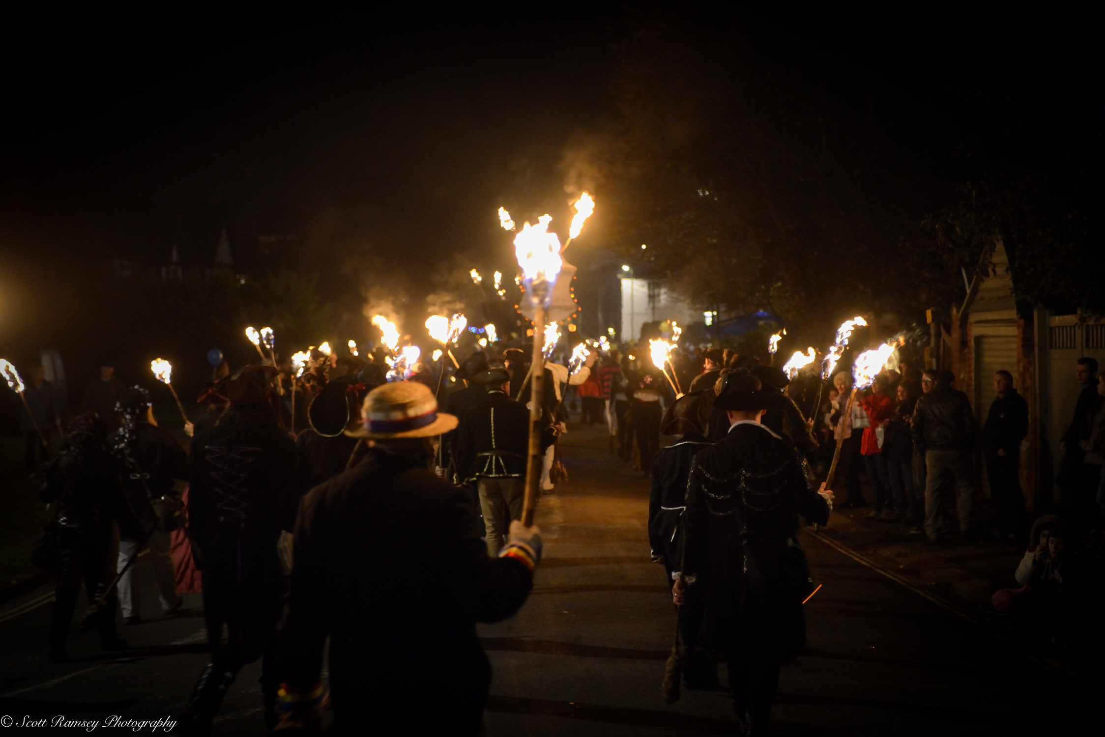 Flaming torches light the way during the procession