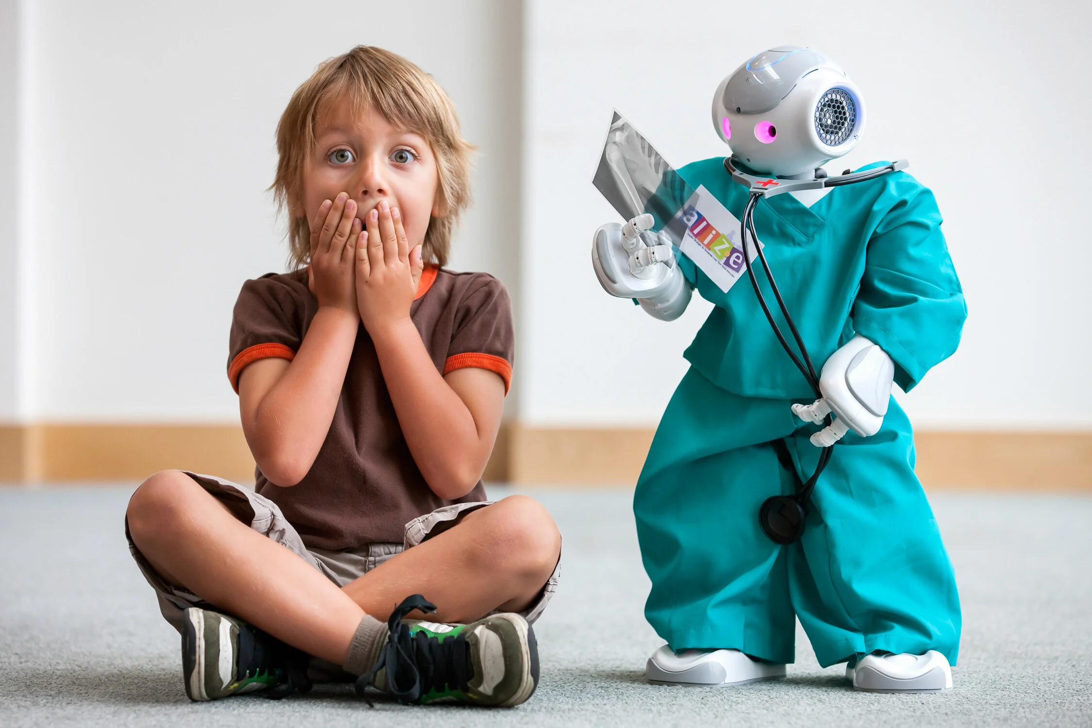 A creative and high-impact press image of a boy interacting with a robot, showcasing the authentic storytelling and "Narrative Difference" provided for national PR and editorial campaigns.