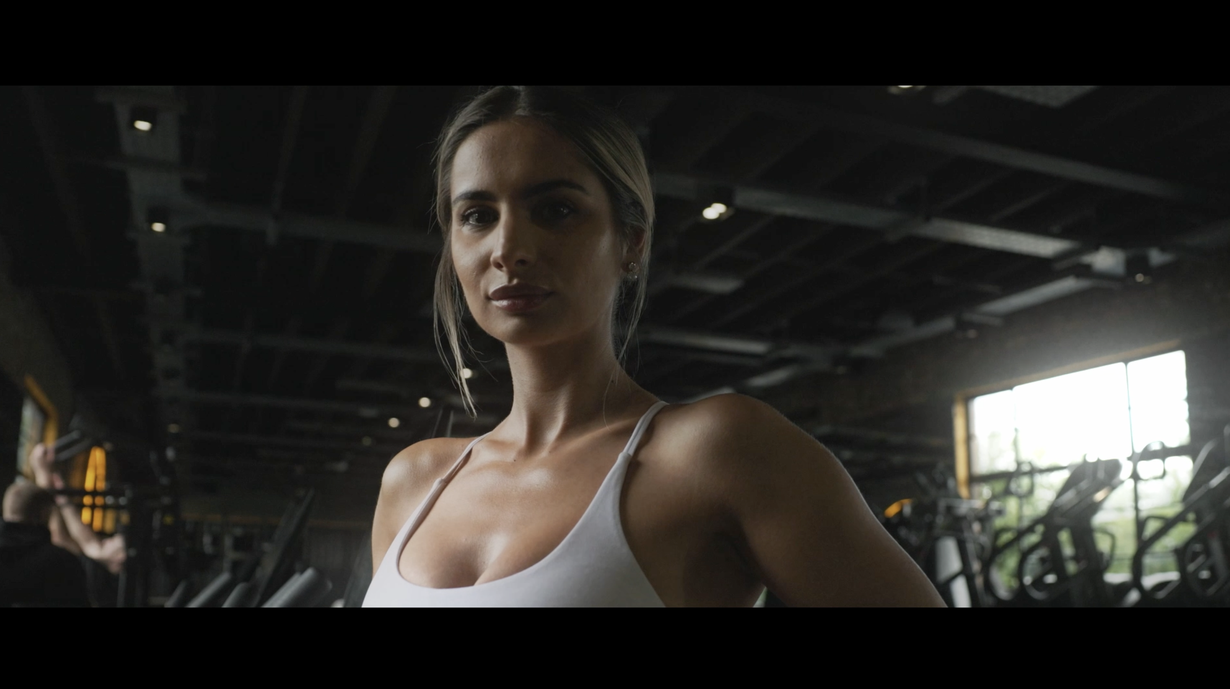 Cinematic social media videography by Scott Ramsey, featuring a high-energy brand story of a female gym instructor, captured for high-impact vertical content on LinkedIn, Instagram, and TikTok.