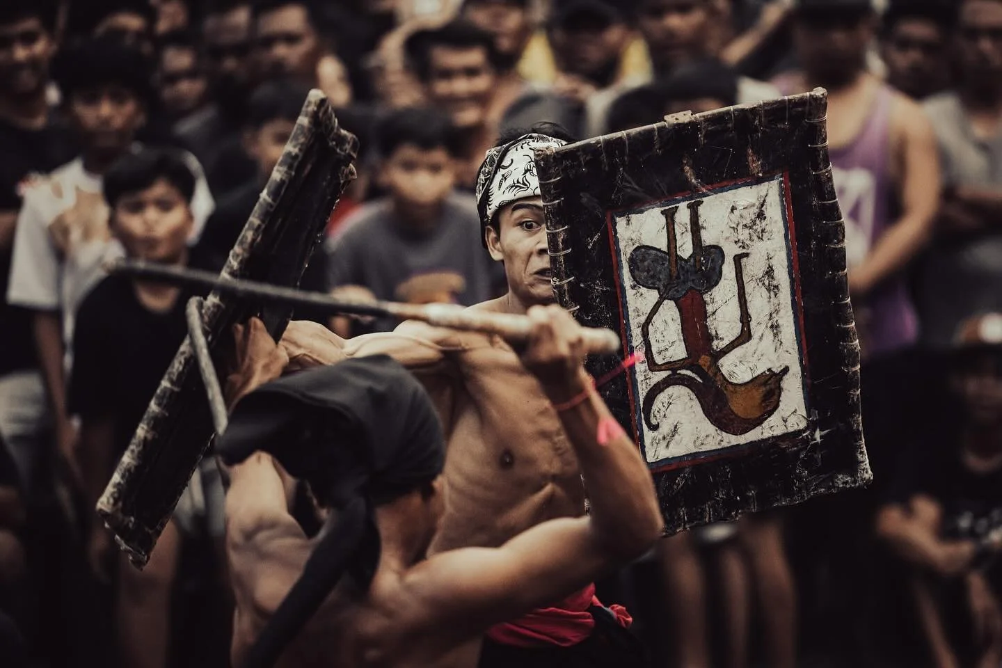 Photographing stick fighting in Indonesia is not for the faint hearted. You arrive early for a good spot, move fast when the action gets close, and shoot even faster. But that&rsquo;s nothing compared to what these warriors endure!
Each fighter battl