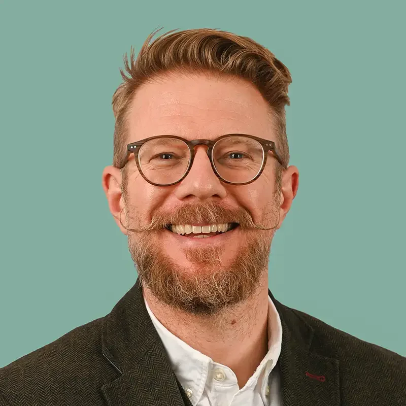 Portrait of Scott Ramsey, Founder and Creative Director of Scott Ramsey Photography & Videography.