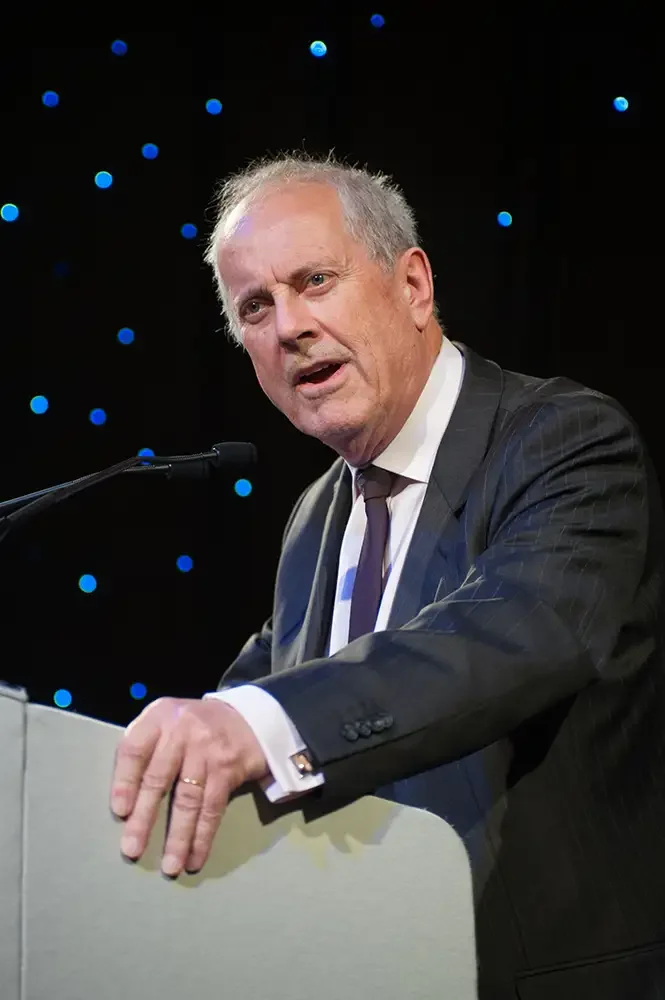 Keynote speaker Gyles Brandreth delivering a presentation at Grosvenor House, Mayfair, captured by London corporate event photographer Scott Ramsey Photography & Videography.