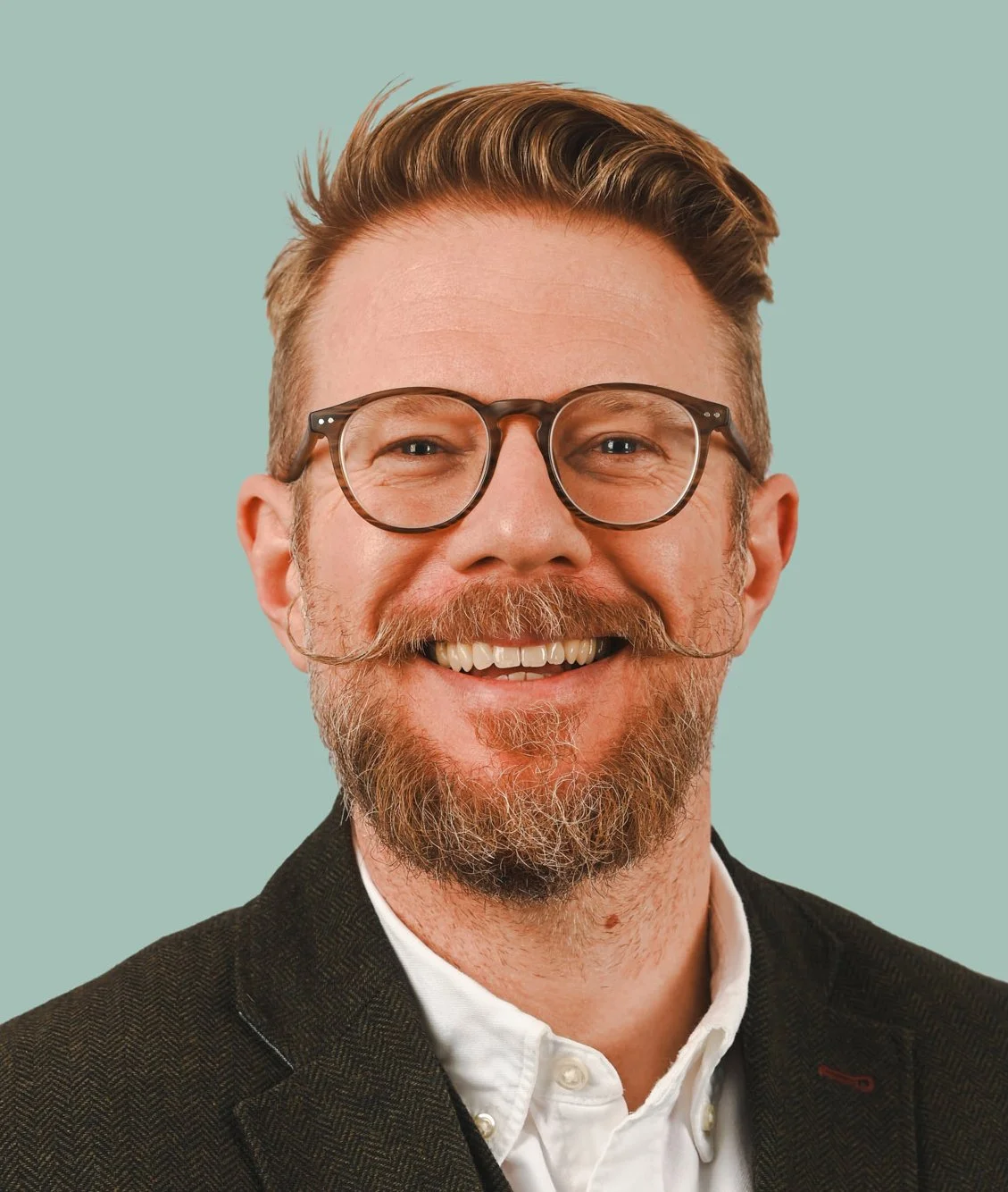 Portrait of Scott Ramsey, Founder and Creative Director of Scott Ramsey Photography & Videography.