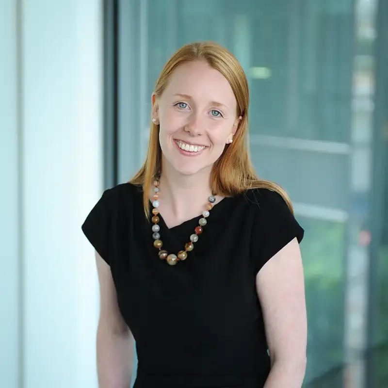 A professional video production setup for a documentary-style CEO interview, featuring high-end cinema cameras and lighting in a corporate environment.