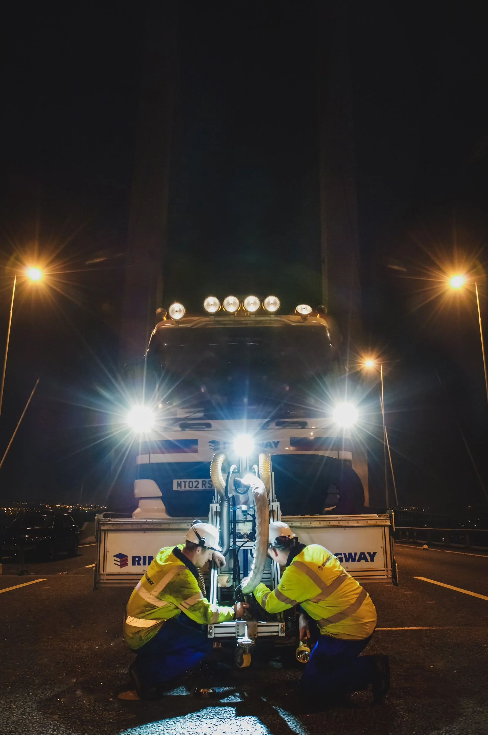 A cinematic production still of Ringway workers on the M25 QE2 Bridge, showcasing the gritty, real-world style of Scott Ramsey’s commercial videography.
