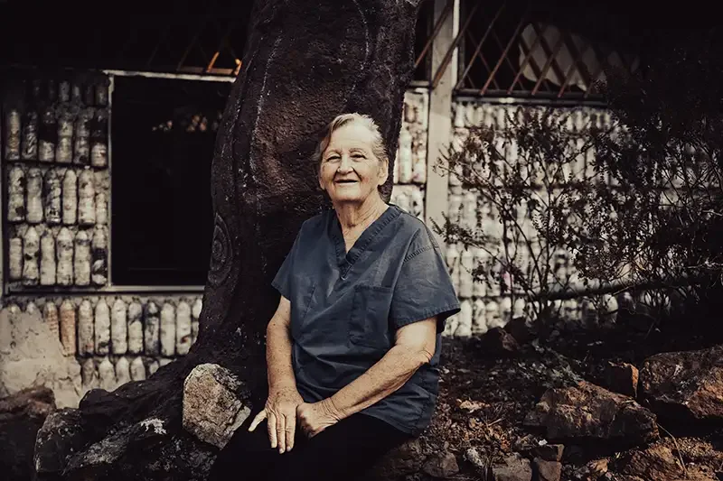 A portrait of Catherine Riley-Bryan (Momo Cat), the founder of the Bamboo School, at her lakeside retreat in Bong-Ti, Thailand. Scott Ramsey captures the leadership and compassion behind this sanctuary near the Myanmar border.