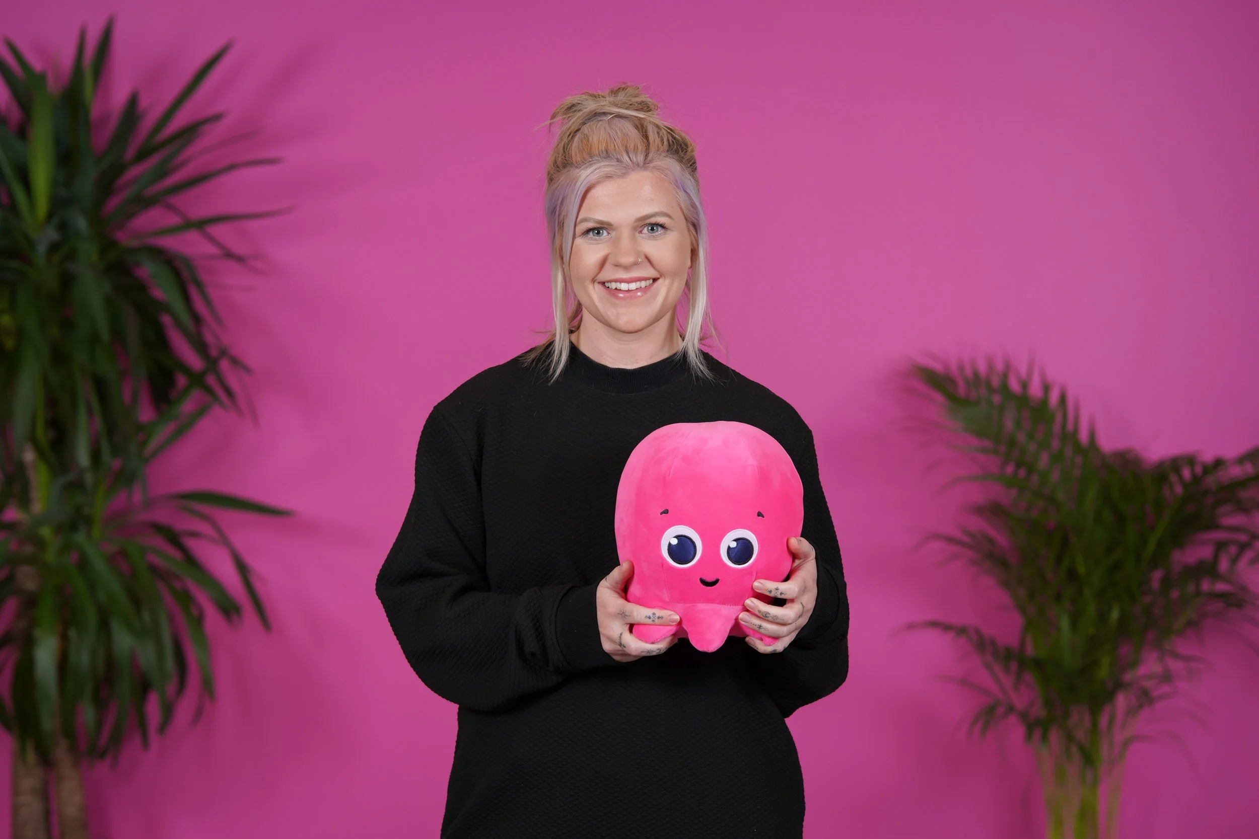 A vibrant corporate staff portrait from a 500-person brand library deployment for Octopus Energy at their Brighton HQ, East Sussex. Shot by Scott Ramsey Photography & Videography to align with enterprise brand identity.