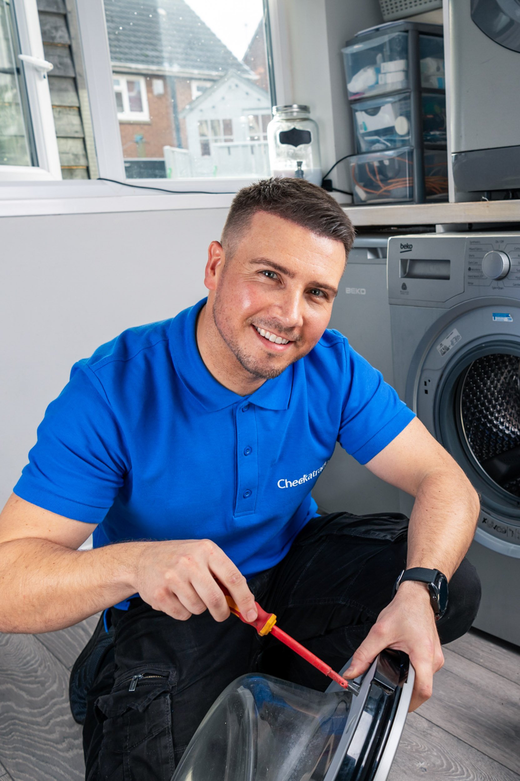 A professional appliance services engineer at work in Chelmsford, Essex, captured by Scott Ramsey Photography and Videography.