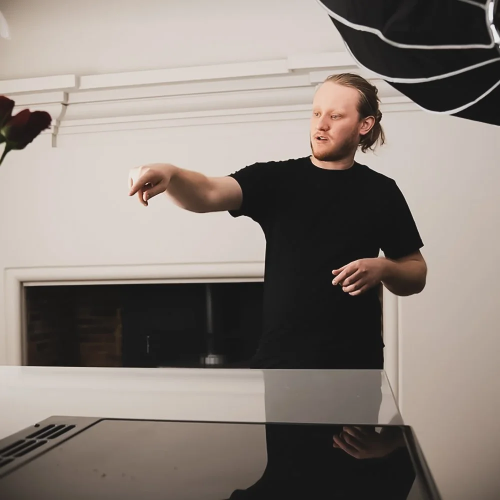 A senior videographer from the Scott Ramsey Photography & Videography team directing a professional commercial production on location in London, ensuring high-end cinematic standards for a brand campaign.