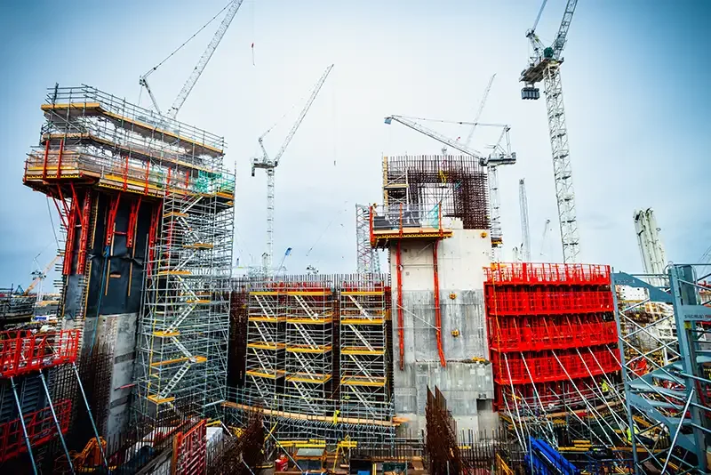 Editorial industrial photography of Hinkley Point C construction, captured by London Corporate Photographer Scott Ramsey for a leading European newspaper. Demonstrates the scale of major UK infrastructure projects.