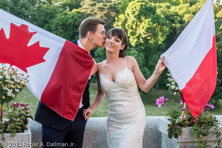 You can see the red reflections from the flags on the bride's dress