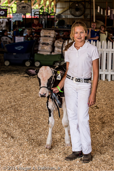 Very proud of her blue ribbon calf