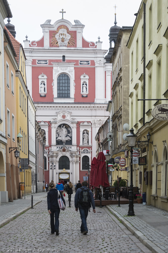 A basilica, at the end of a Poznan, Poland, street