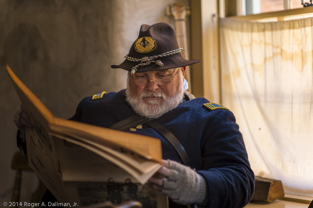 What is behind the captain's left ear?