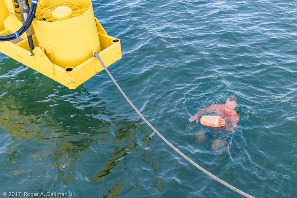 Recovering the marker buoy before lowering the fans