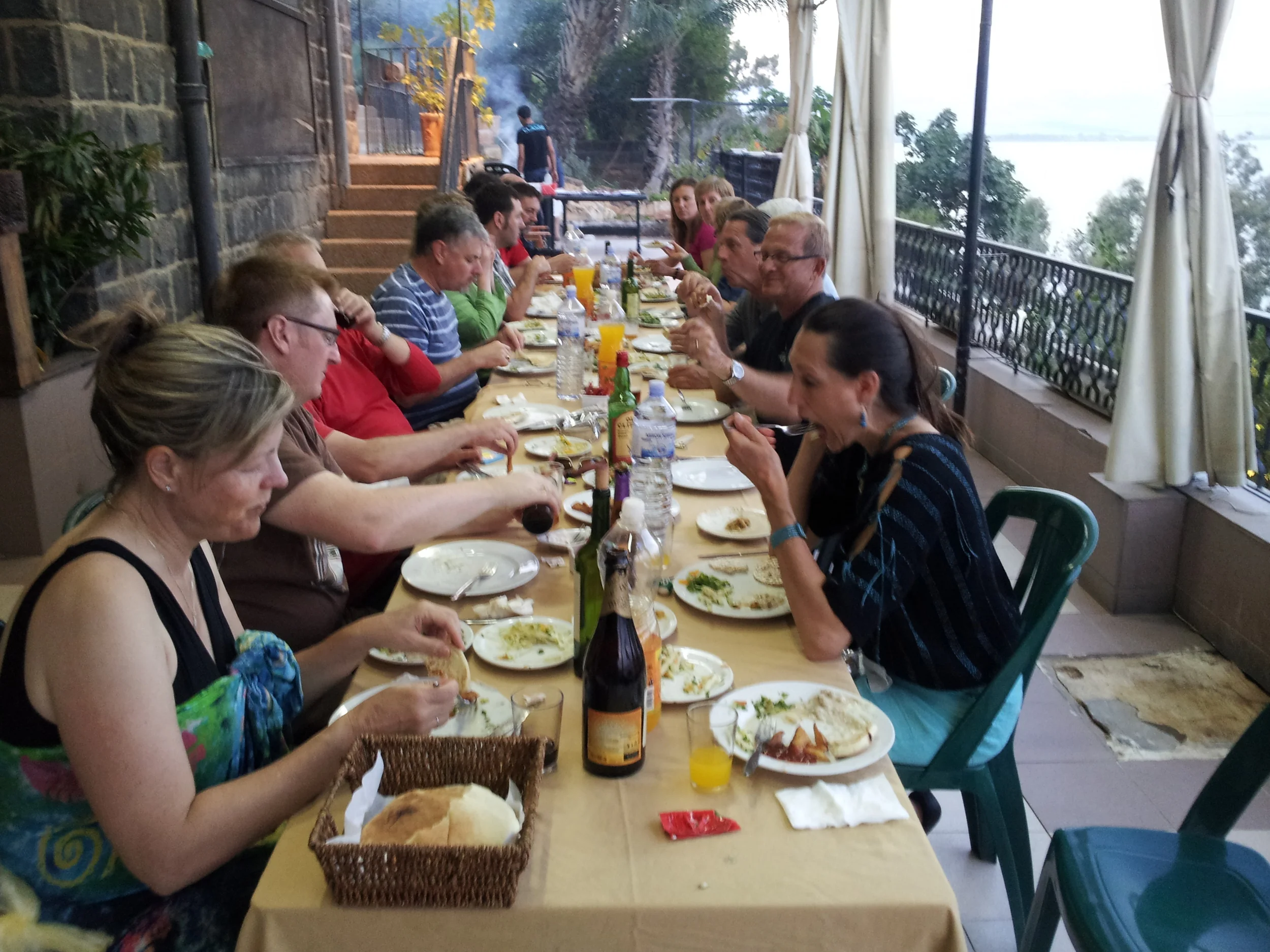 Eating on the veranda overlooking the Sea of Galilee