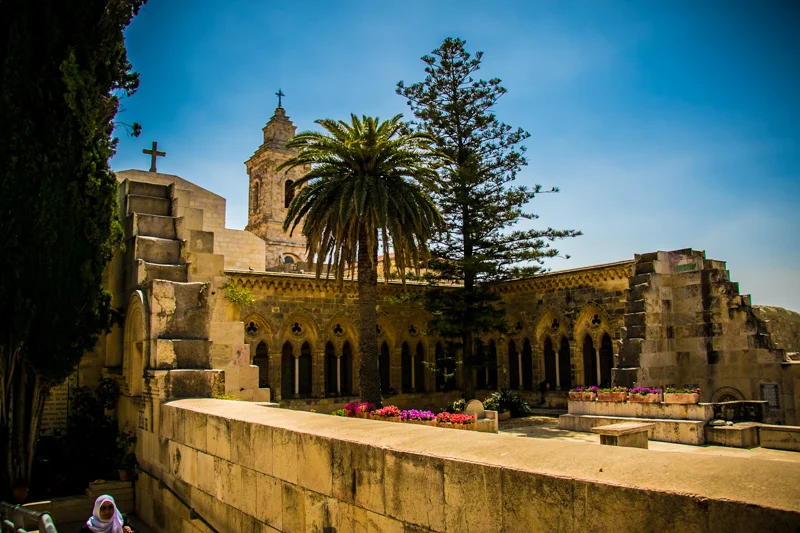 The massive ruins of the Constantinian Church of the Ascension on the Mount of Olives now enclose a lovely garden where Jesus' teachings overlooking the city of Jerusalem are remembered. 