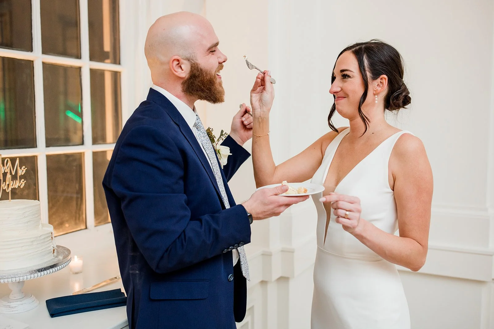 bridal-couple-eating-wedding-cake.jpg