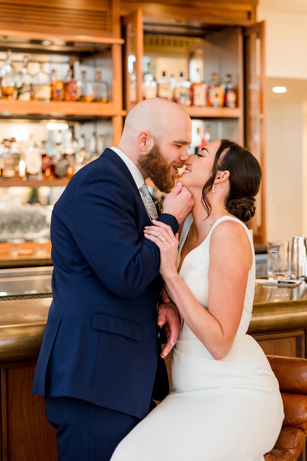 bridal-couple-kissing-at-bar.jpg