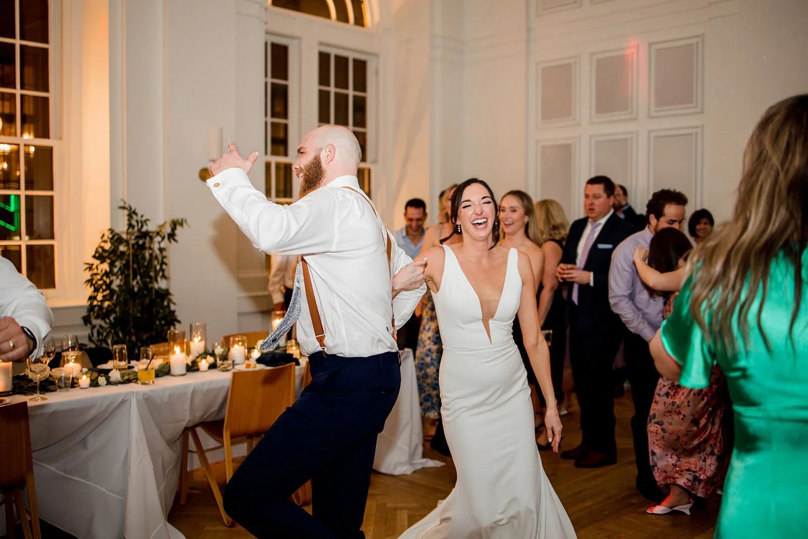 bridal-couple-laughing-at-wedding-reception.jpg