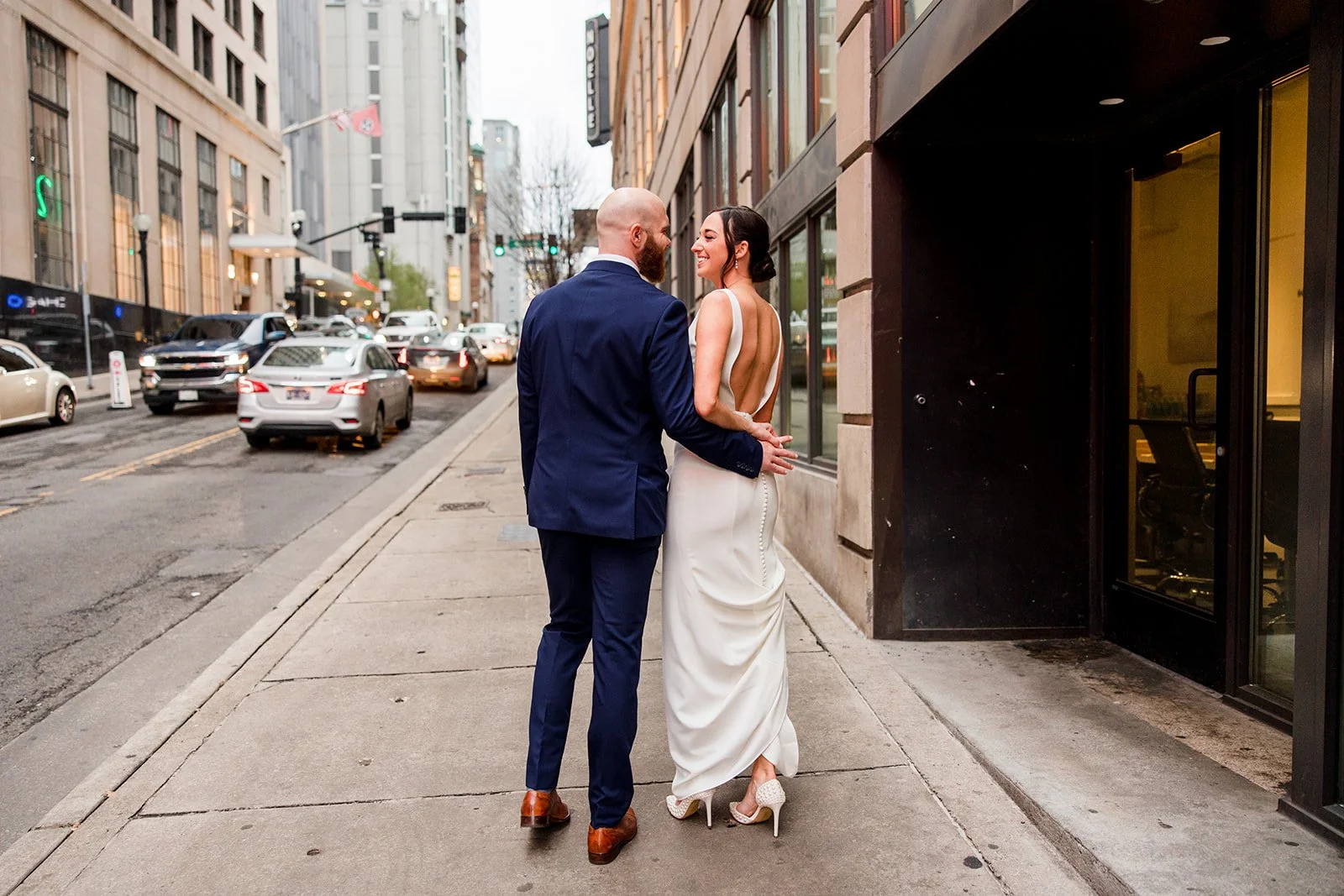 bridal-couple-walking-down-street.jpg