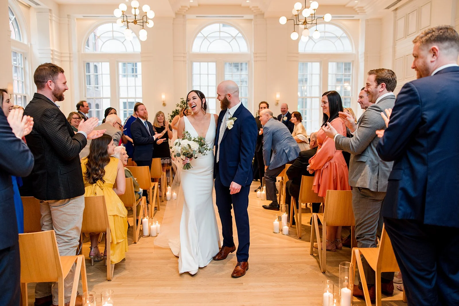 bride-and-groom-laughing-in-aisle.jpg