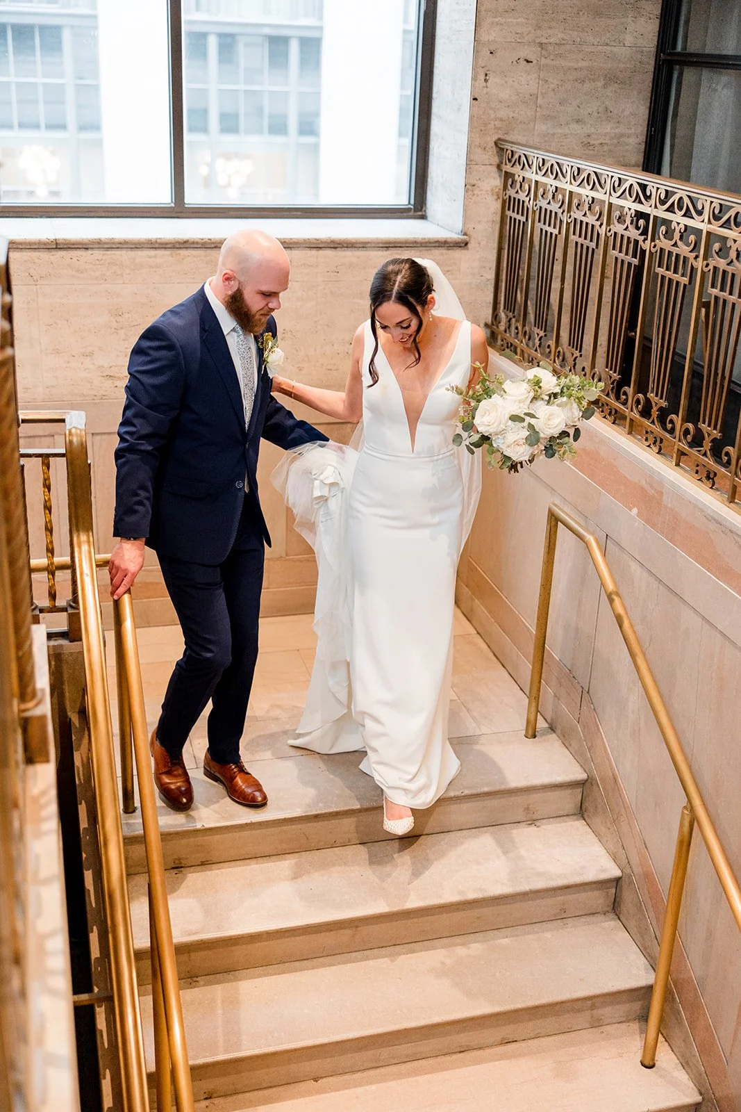 bride-and-groom-walking-downstairs.jpg