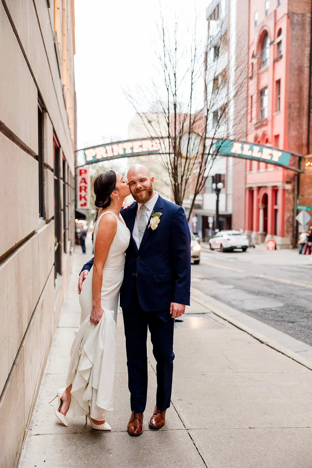 bride-kissing-groom-printers-alley.jpg