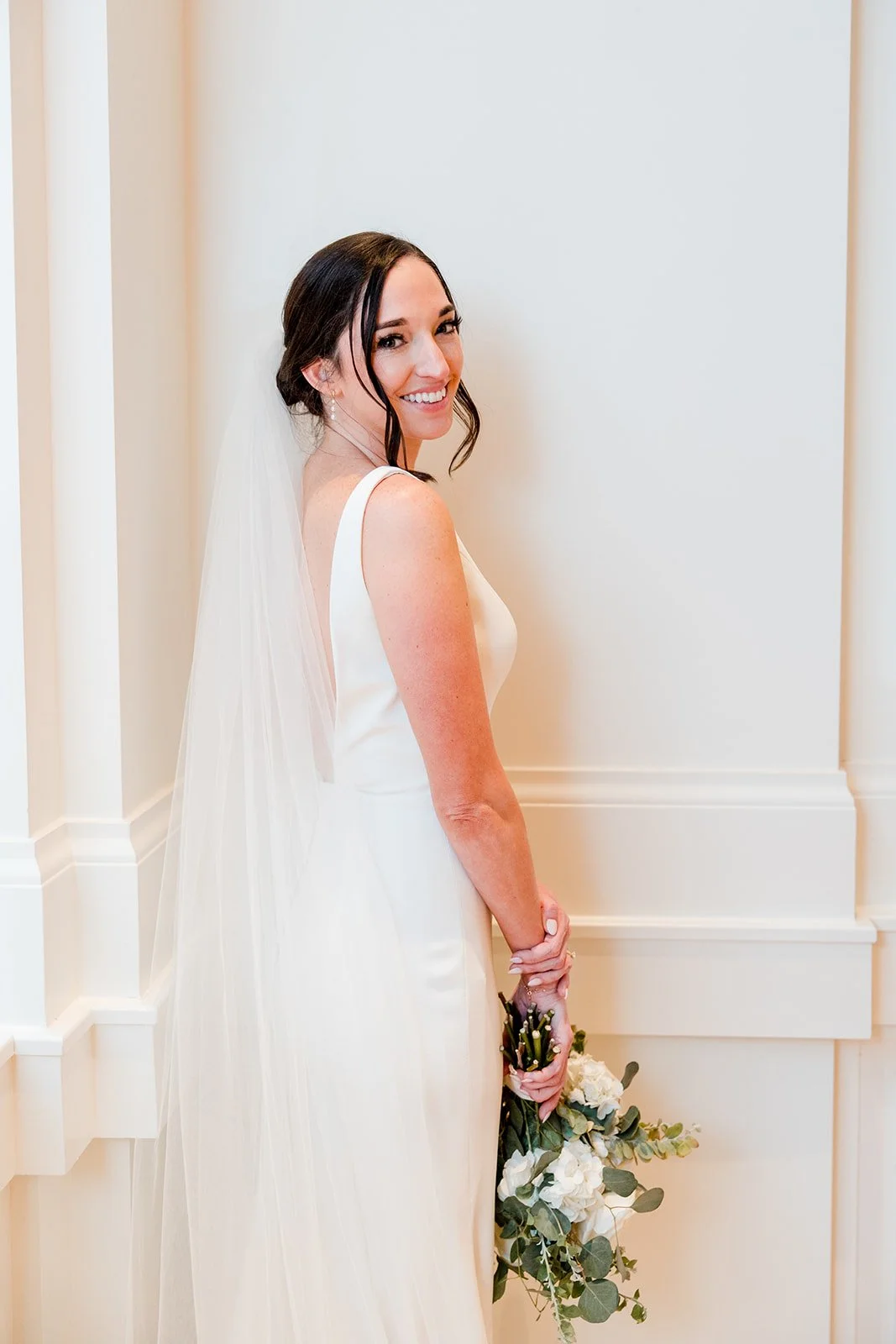 bride-smiling-over-shoulder.jpg