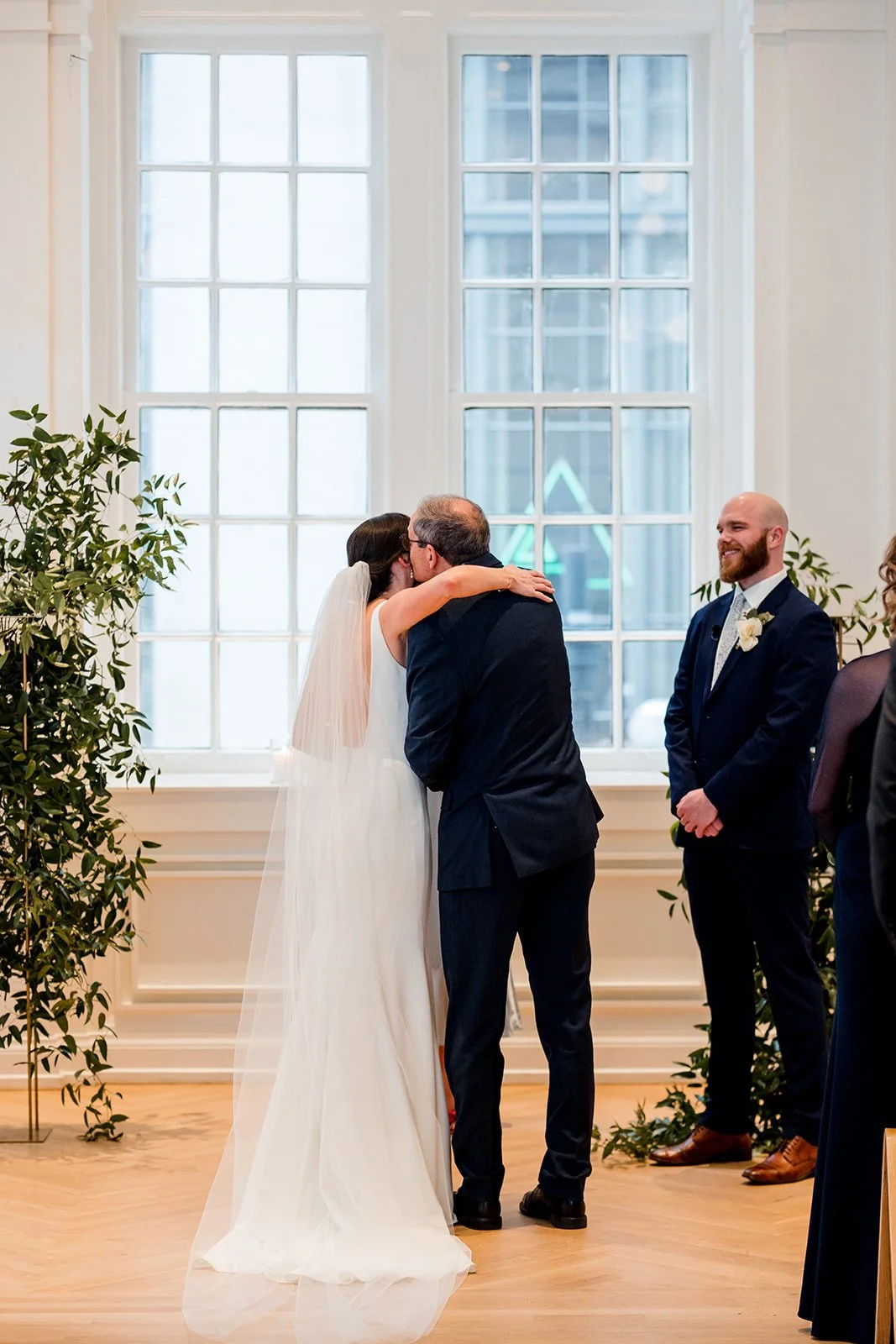 father-kissing-bride-on-the-cheek.jpg