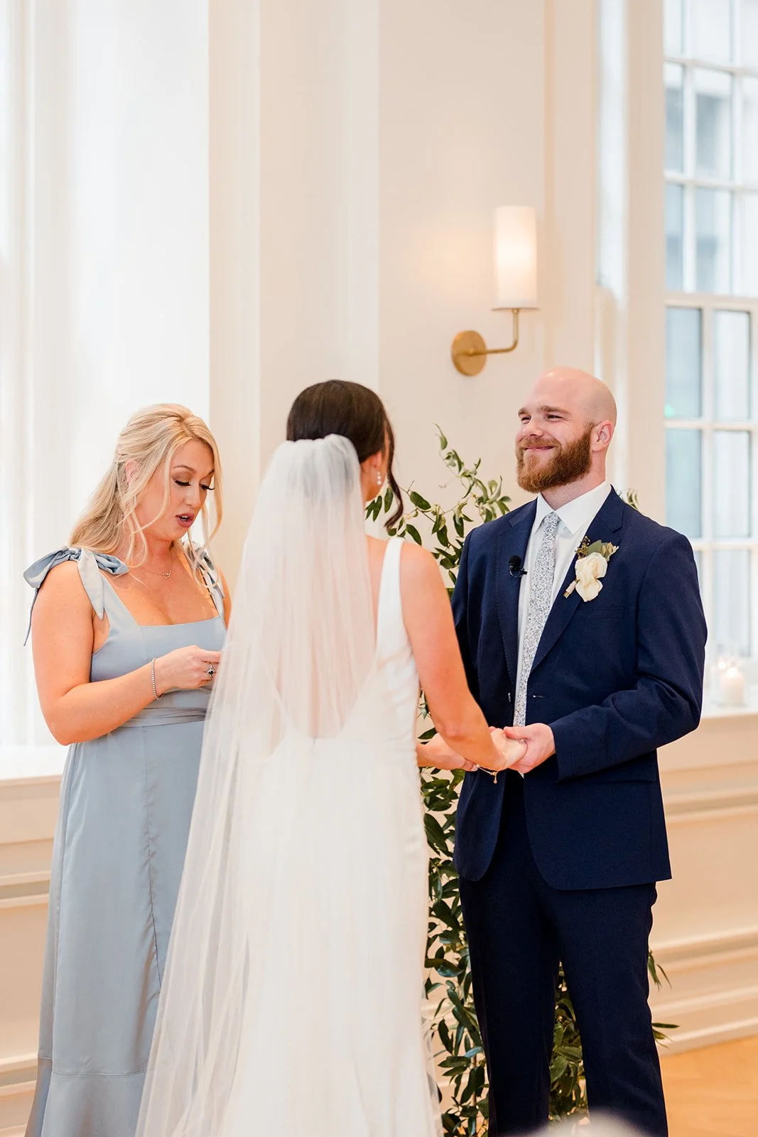 groom-smiling-at-bride-at-ceremony.jpg