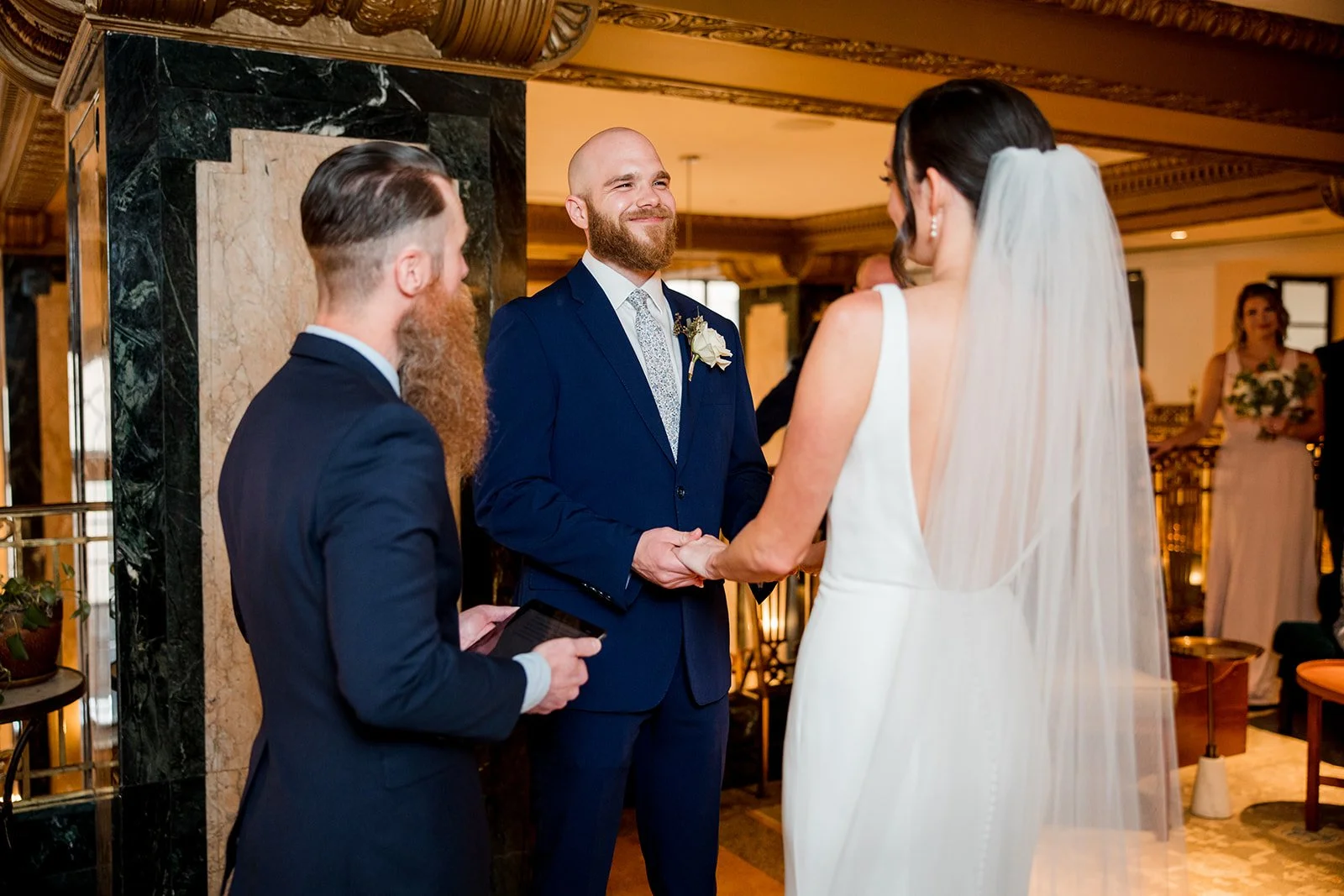 groom-smiling-during-wedding-ceremony.jpg