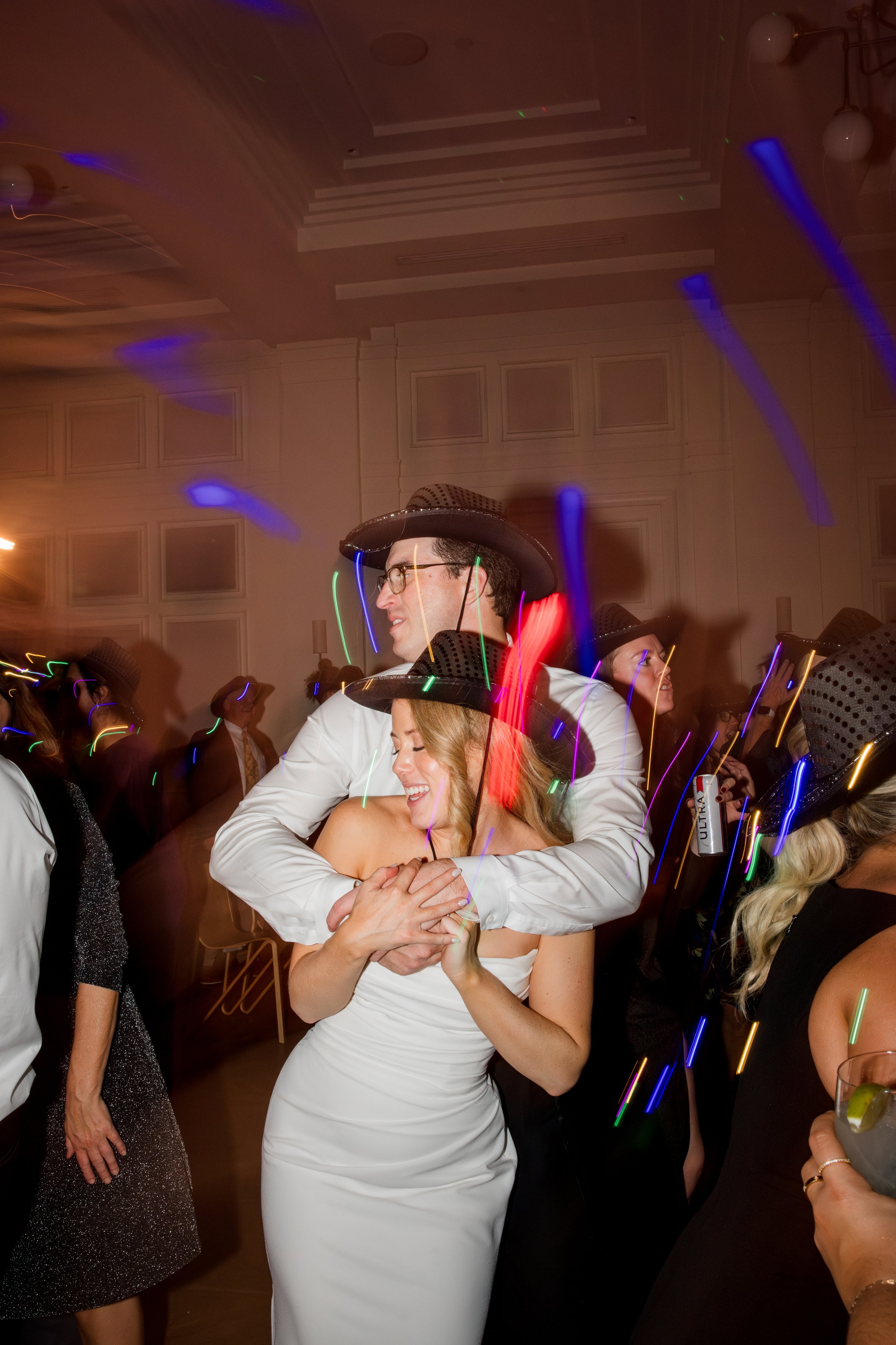 bride-groom-dancing-wearing-cowboy-hats.jpg
