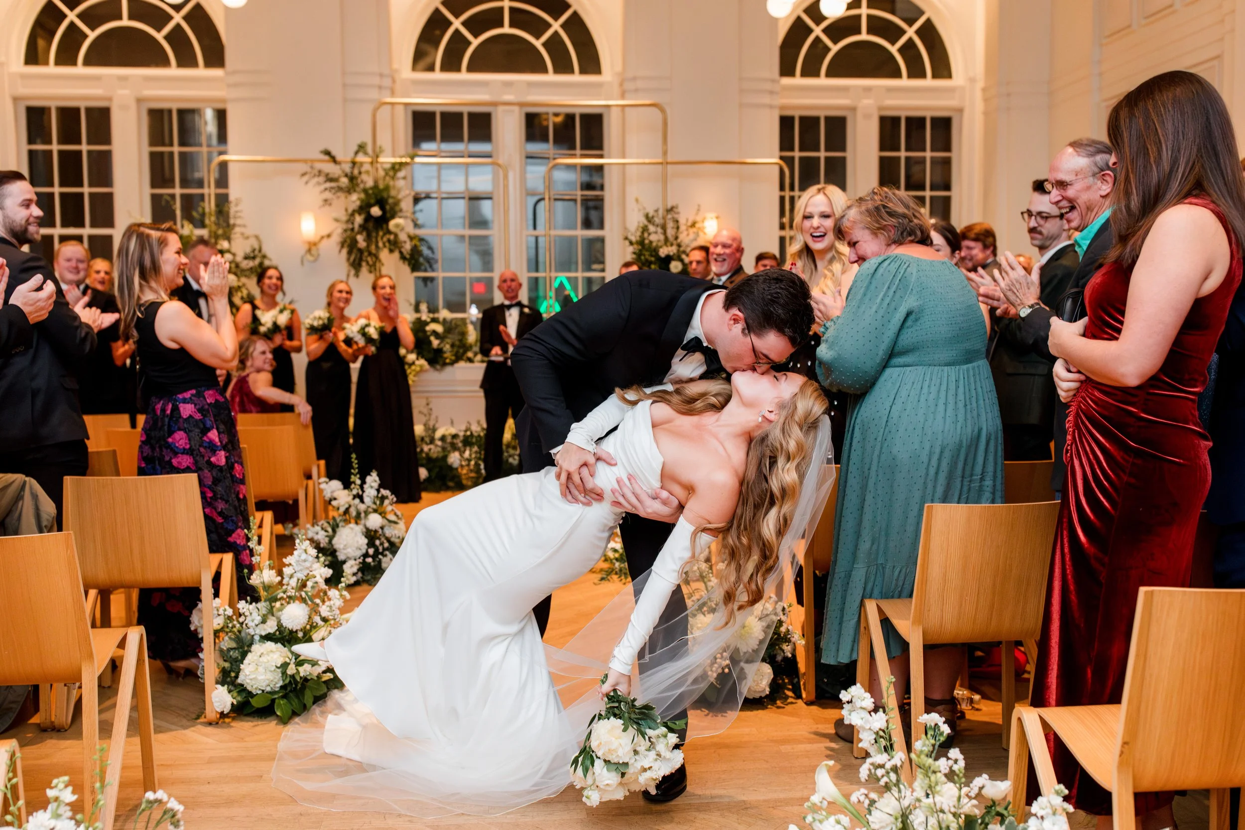 bride-groom-dip-kiss-in-aisle.jpg