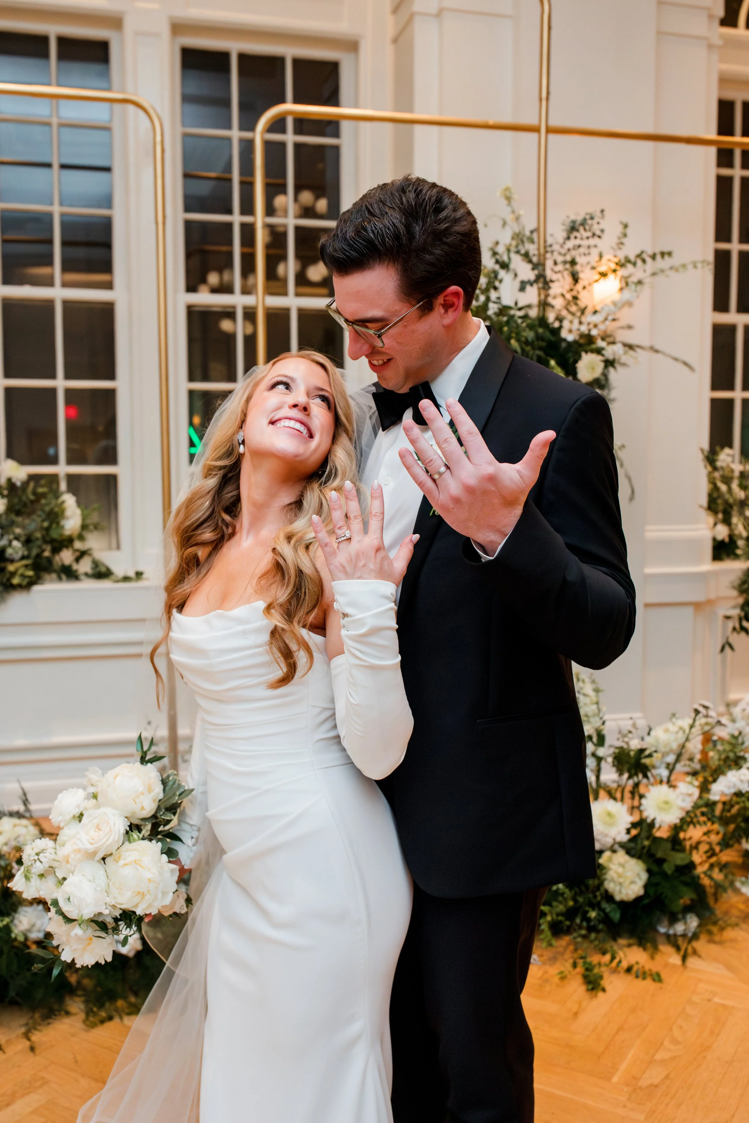 bride-groom-showing-off-rings.jpg