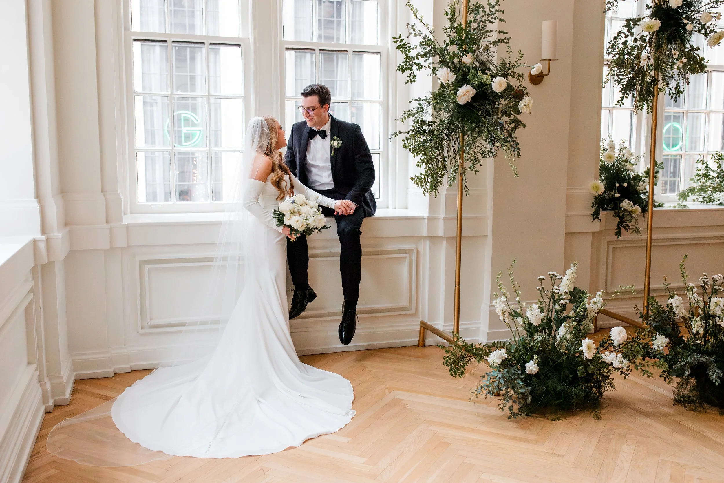 bride-groom-sitting-in-window-seat.jpg