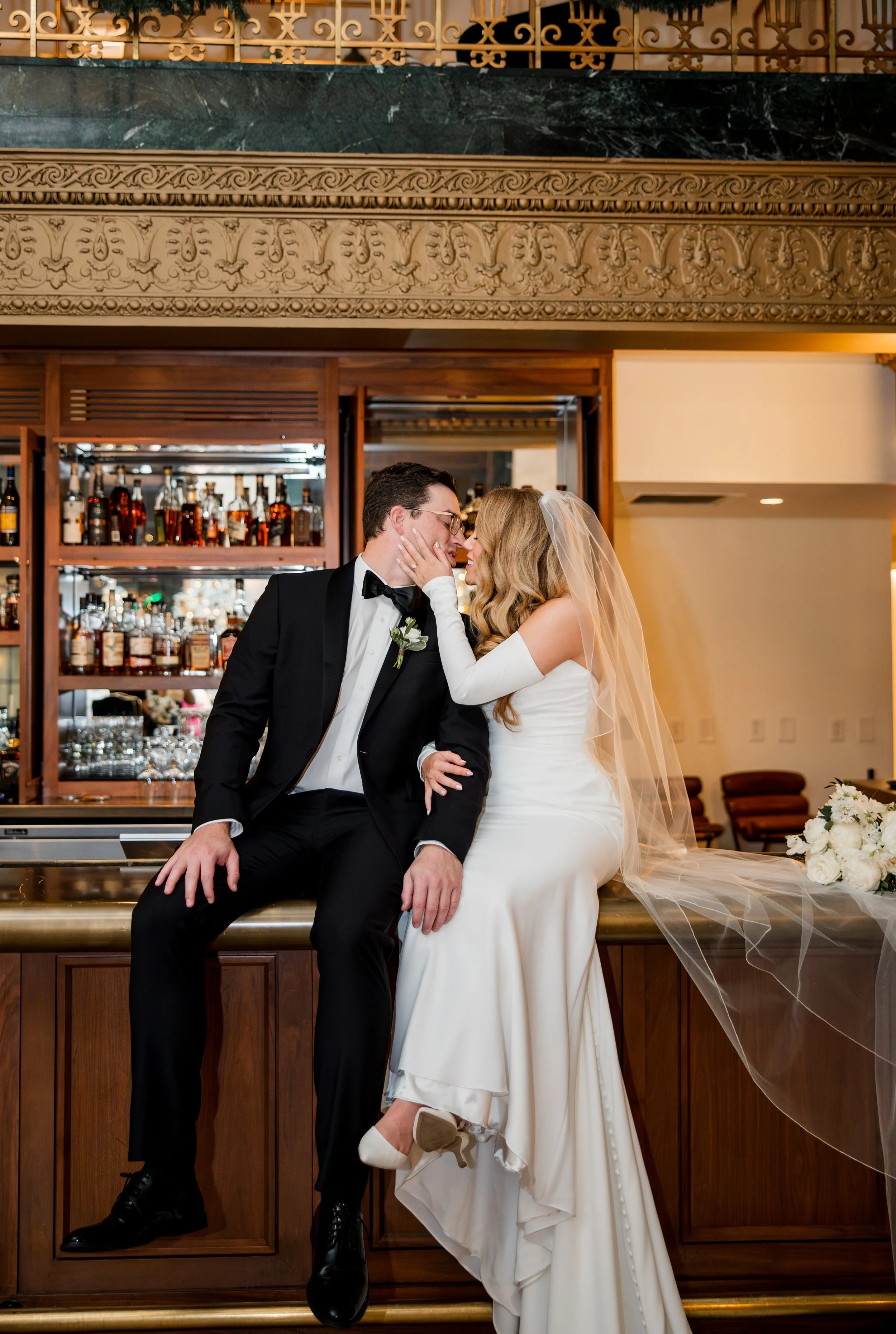 bride-groom-sitting-on-bar.jpg