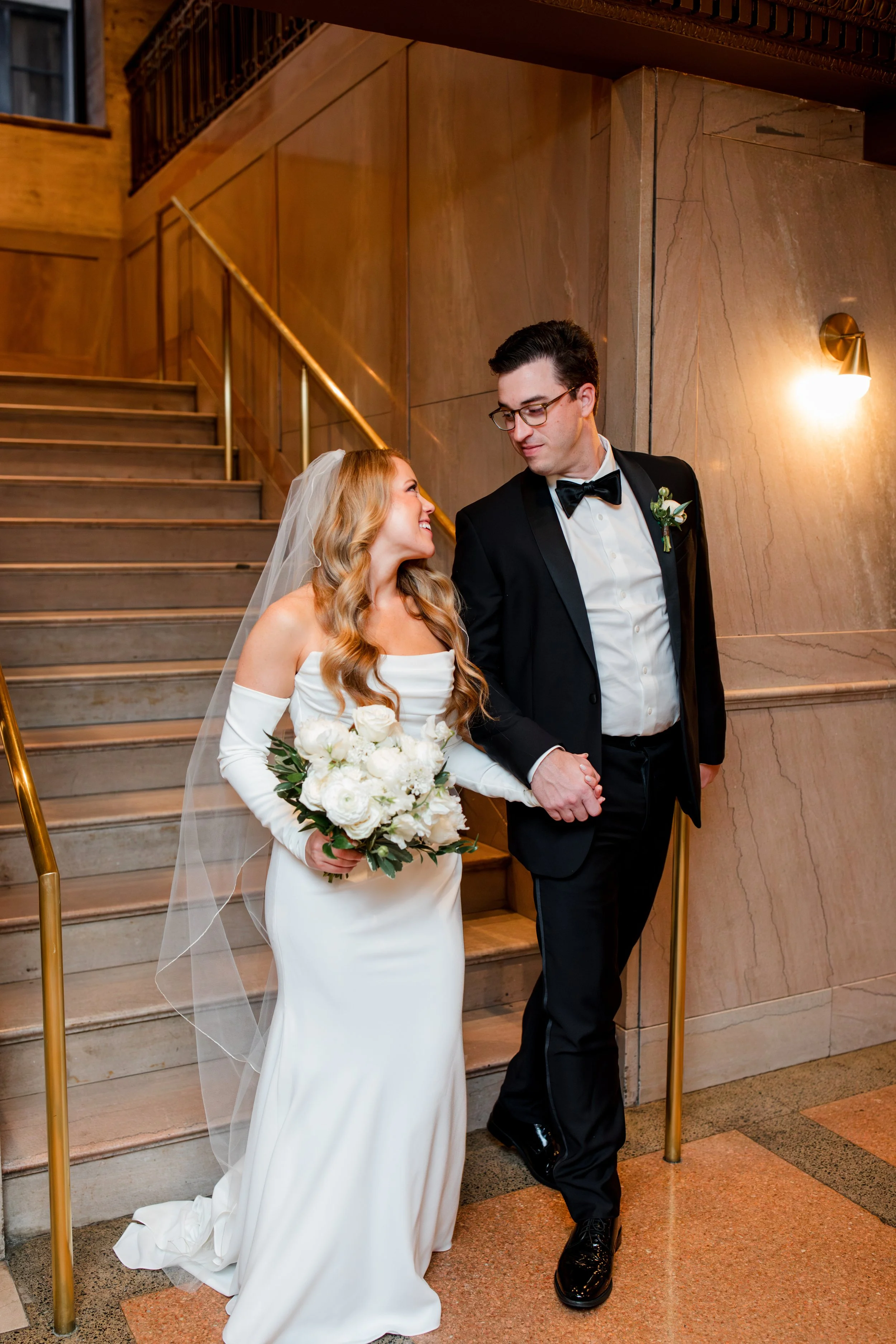bride-groom-walking-down-stairs.jpg