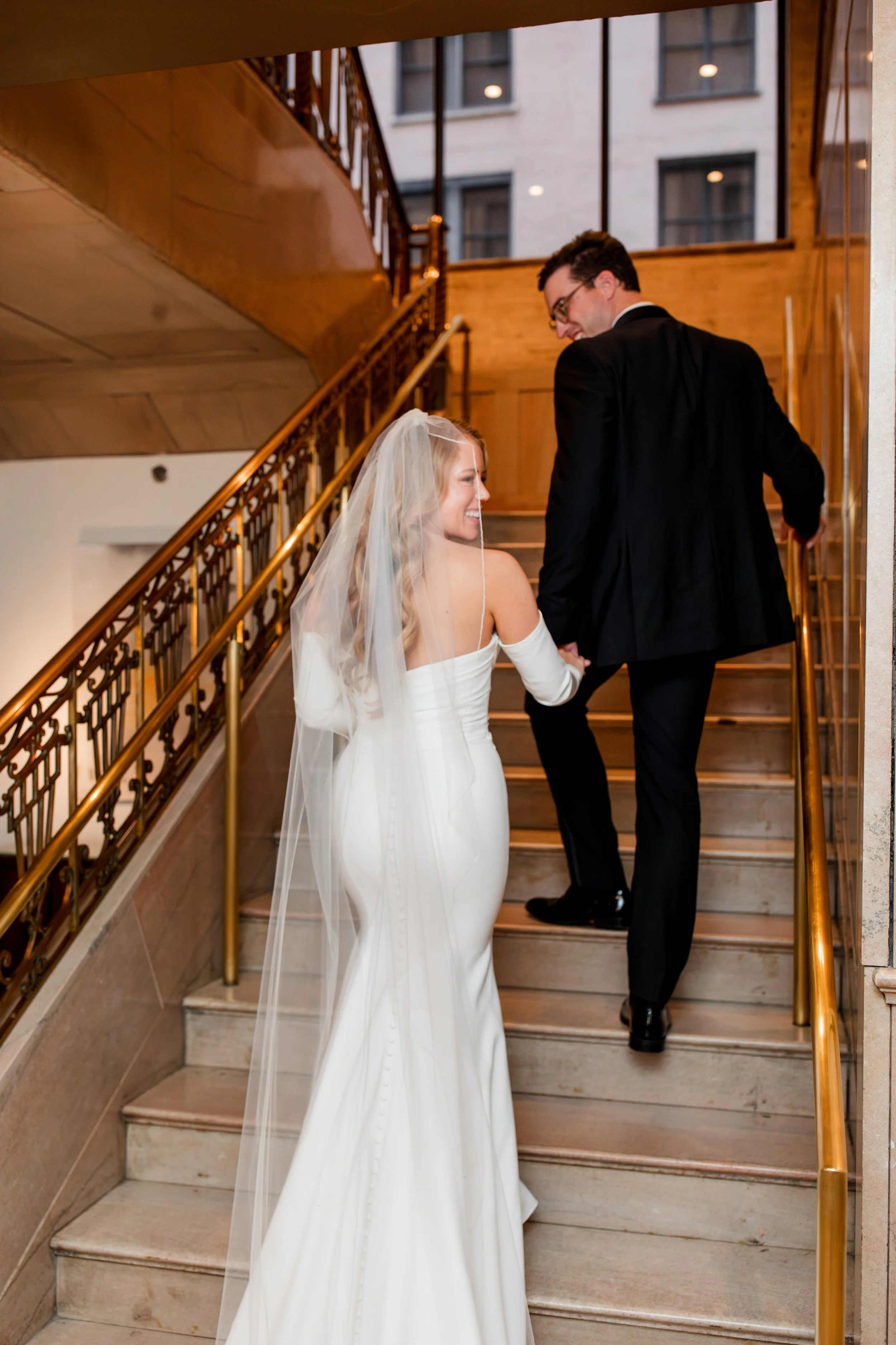 bride-groom-walking-up-stairs.jpg
