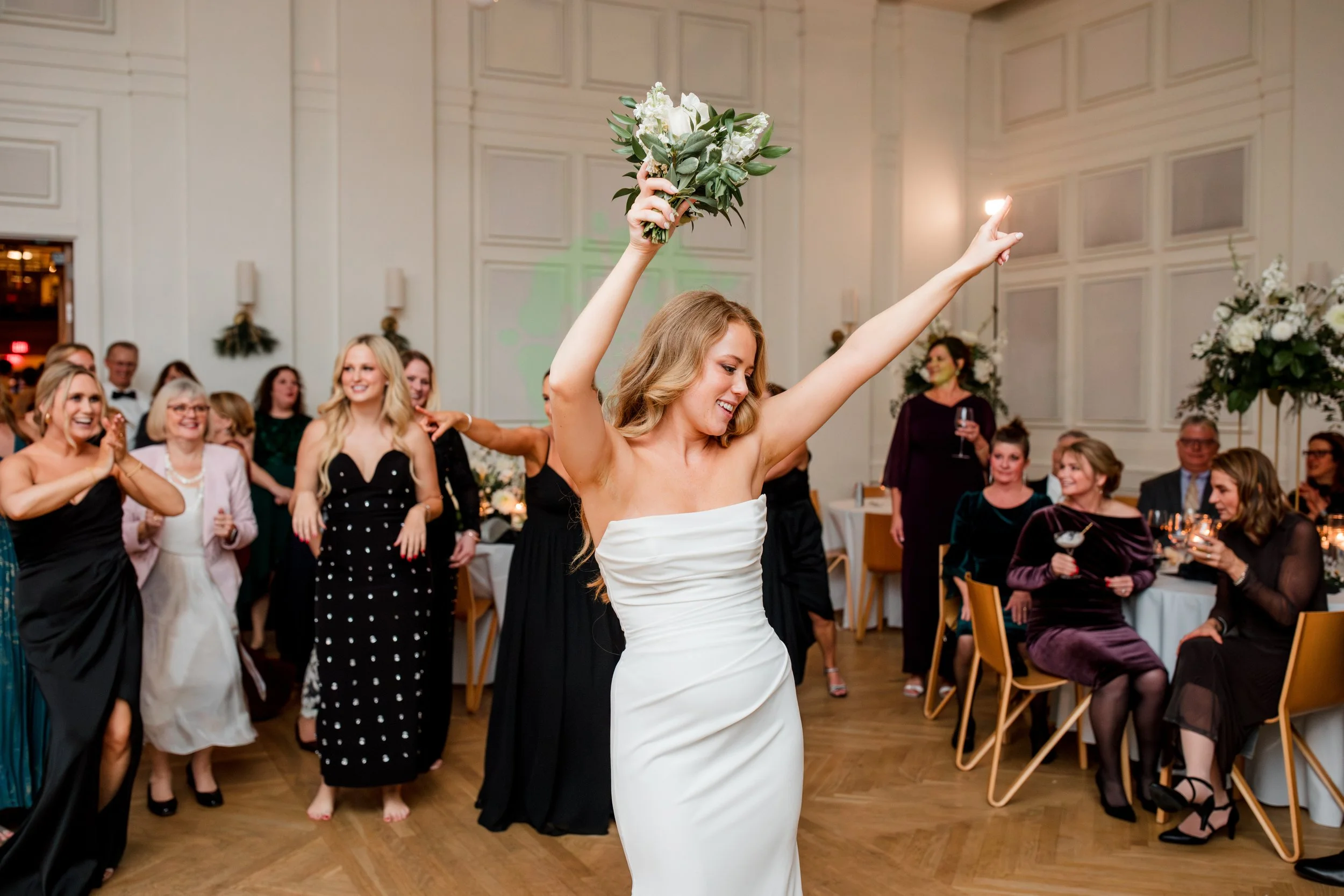 bride-holding-toss-bouquet.jpg