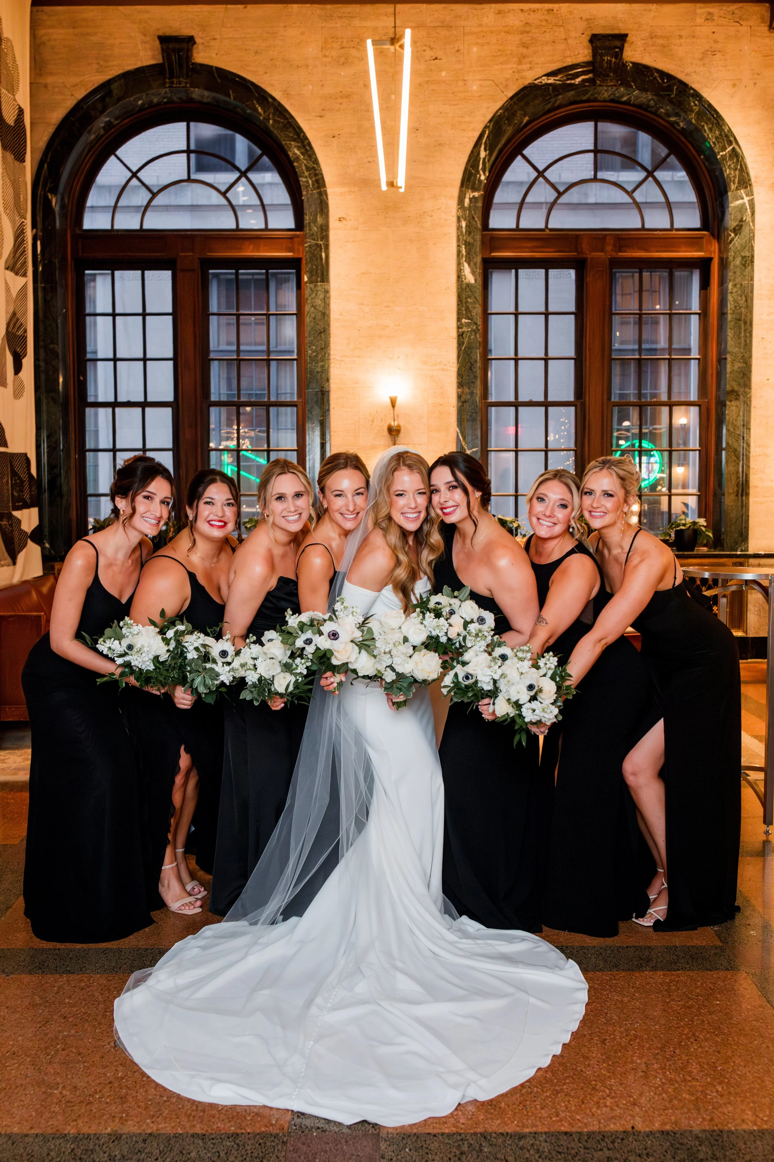 bride-smiling-with-bridesmaids.jpg