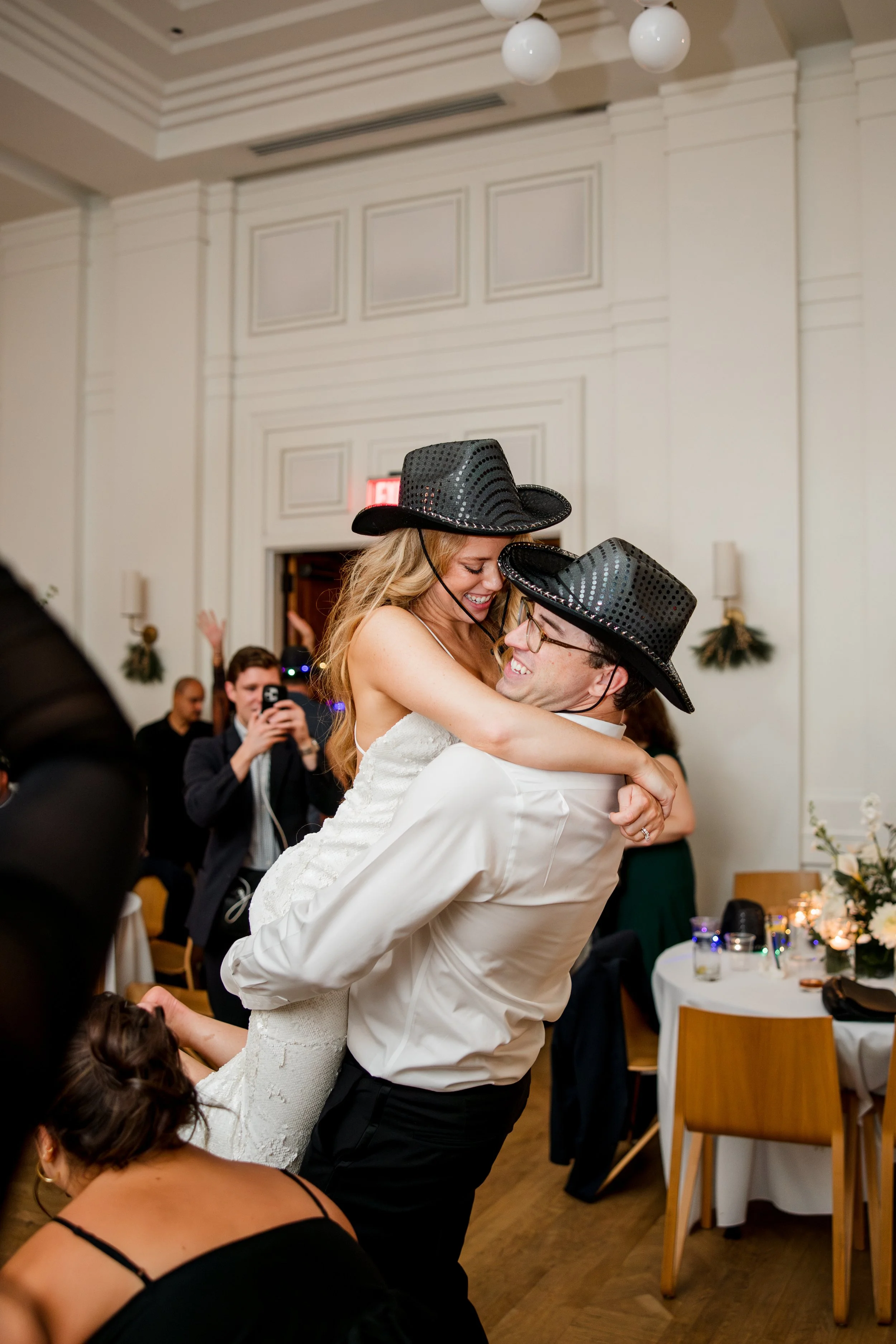 groom-lifting-bride-during-reception.jpg